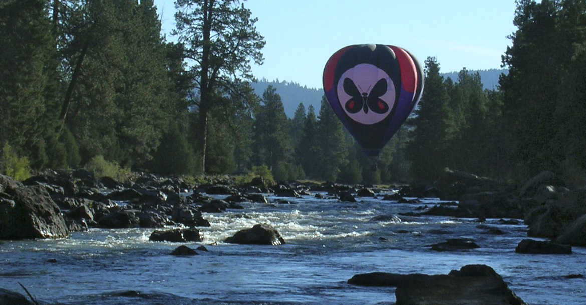 'Mountain Butterfly' hot-air balloon executing a 'touch and go' on the Blackfoot River in Western Montana at mile-marker 27 along route 200, Greenough, MT

photo credit: Lee Marcum