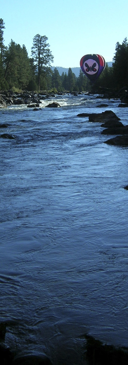 'Mountain Butterfly' balloon skimming over the 'Blackfoot River'; Greenough area.