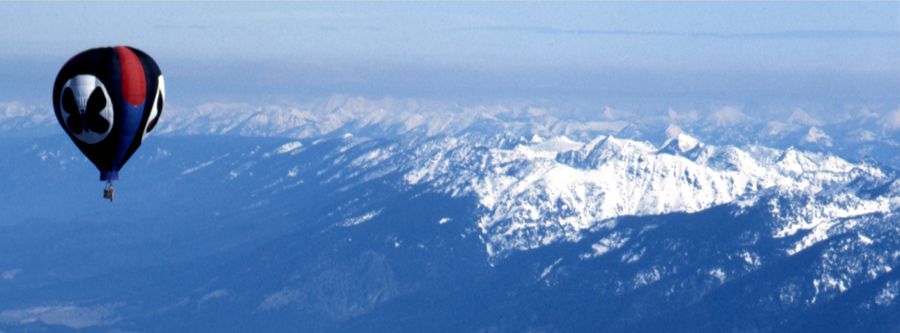 Mountain Butterfly over Flathead Valley in Western Montana, with the Mission Mountains on right mid-frame and Glacier Park in the far distance, center and right in frame